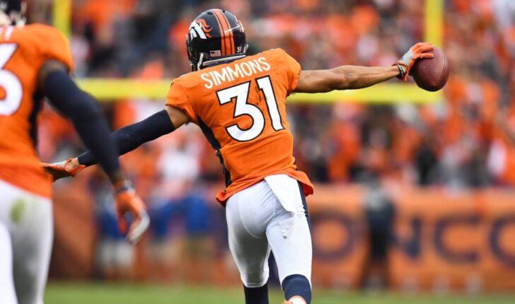 Denver Broncos strong safety Justin Simmons (31) reacts following his interception in the fourth quarter against the Oakland Raiders at Sports Authority Field at Mile High.