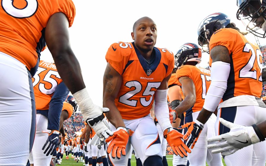 Chris Harris Jr. gets low fives from teammates pre-game. Credit: Ron Chenoy, USA TODAY Sports.