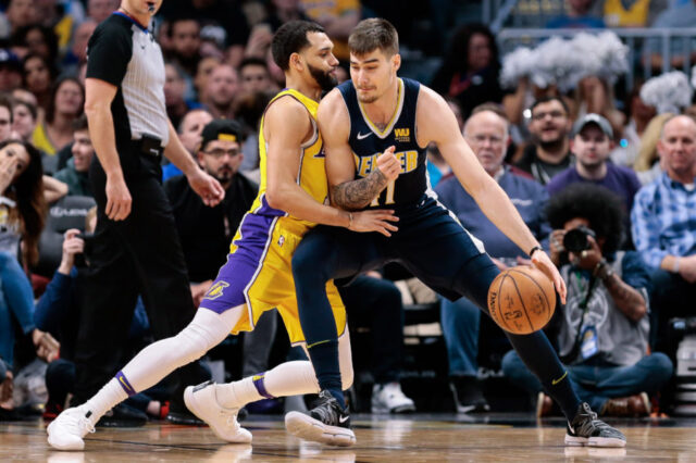 Denver Nuggets forward Juancho Hernangomez (41) dribbles against Los Angeles Lakers guard Tyler Ennis (left) in the third quarter at the Pepsi Center.