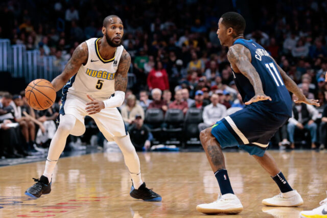 Minnesota Timberwolves guard Jamal Crawford (11) guards Denver Nuggets guard Will Barton (5) in the second quarter at the Pepsi Center.