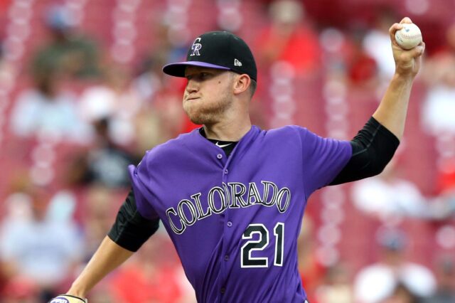 Kyle Freeland pitching Tuesday night in purple against the Reds on the road. Credit: Aaron Doster, USA TODAY Sports.