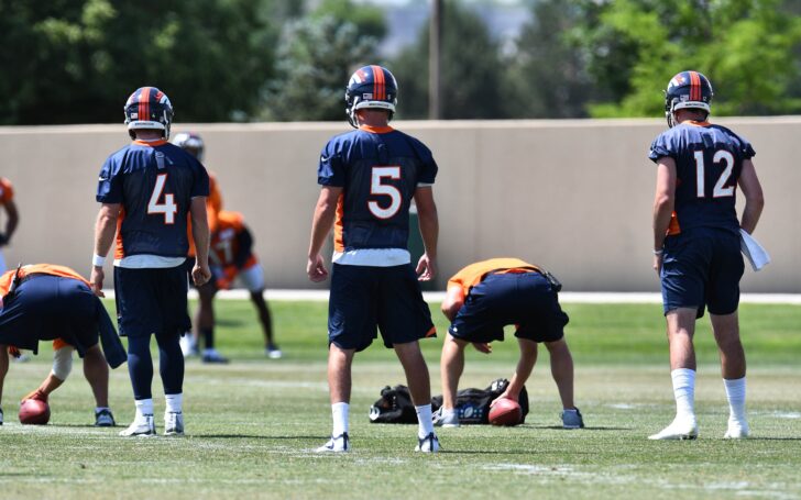 Case Keenum (4) and Paxton Lynch (12) take snaps at Broncos OTAs. Credit: Ron Chenoy, USA TODAY Sports.