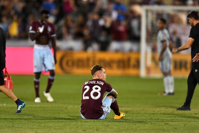 Colorado Rapids midfielder Sam Nicholson (28) sits on the pitch following the draw to the Chicago Fire at Dick's Sporting Goods Park