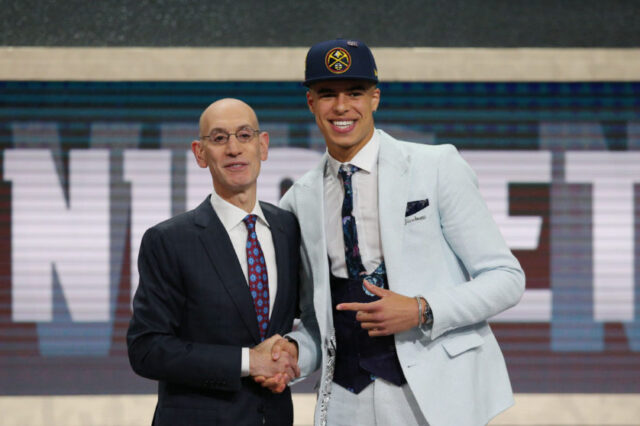 Michael Porter, Jr. (Missouri) greets NBA commissioner Adam Silver after being selected as the number fourteen overall pick to the Denver Nuggets in the first round of the 2018 NBA Draft at the Barclays Center.