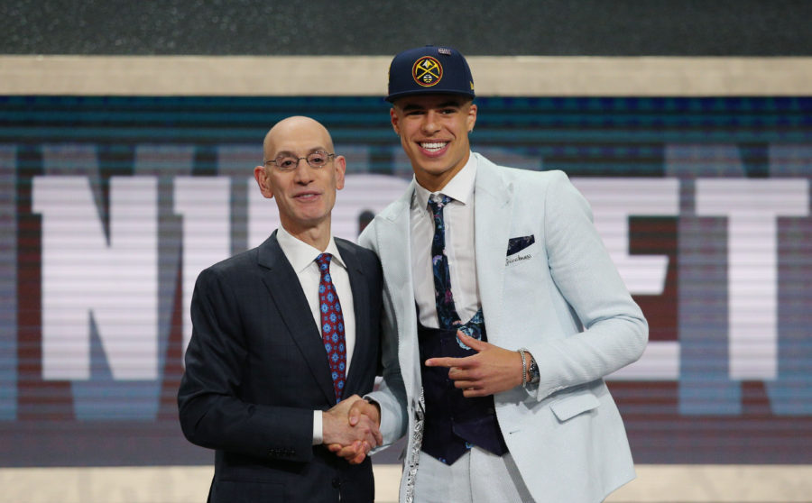 Michael Porter, Jr. (Missouri) greets NBA commissioner Adam Silver after being selected as the number fourteen overall pick to the Denver Nuggets in the first round of the 2018 NBA Draft at the Barclays Center.