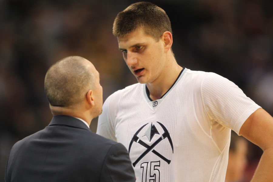 Denver Nuggets head coach Michael Malone (left) talks with Denver Nuggets forward Nikola Jokic (15) during the first half at Pepsi Center. The Nuggets won 132-120.