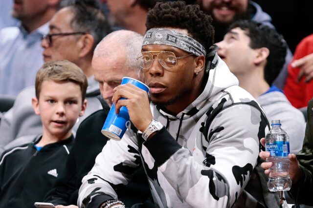 Brandon Marshall, courtside at a Nuggets game. Credit: Ron Chenoy, USA TODAY Sports.