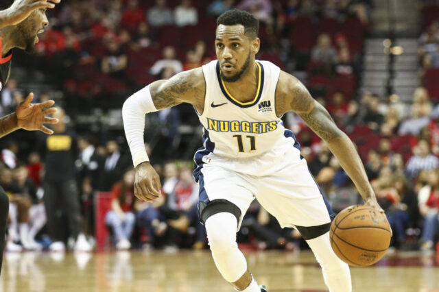 Denver Nuggets guard Monte Morris (11) dribbles the ball during the game against the Houston Rockets at Toyota Center.