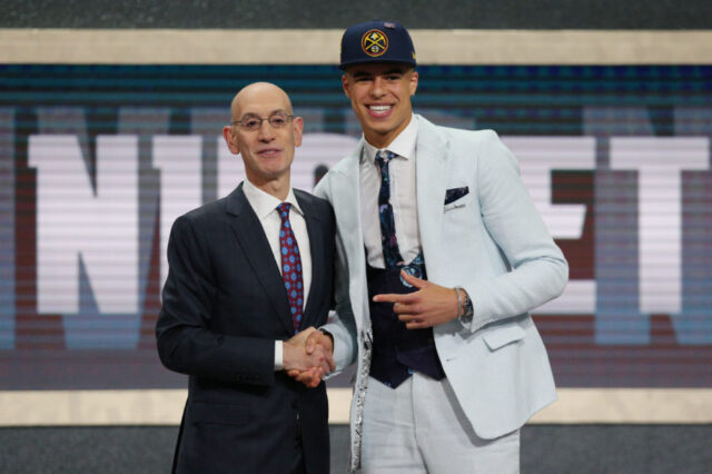 Michael Porter, Jr. (Missouri) greets NBA commissioner Adam Silver after being selected as the number fourteen overall pick to the Denver Nuggets in the first round of the 2018 NBA Draft at the Barclays Center.