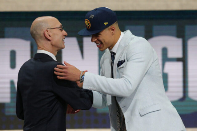 Michael Porter, Jr. (Missouri) greets NBA commissioner Adam Silver after being selected as the number fourteen overall pick to the Denver Nuggets in the first round of the 2018 NBA Draft at the Barclays Center.