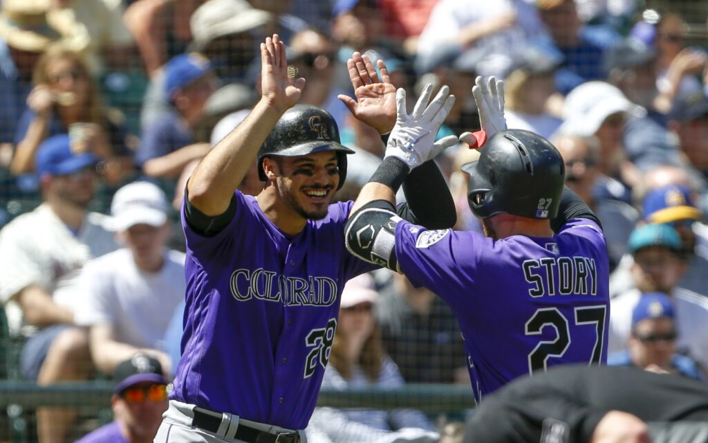 Nolan Arenado and Trevor Story celebrate Story's home run during Sunday's game. Credit: Jennifer Buchanan, USA TODAY Sports.