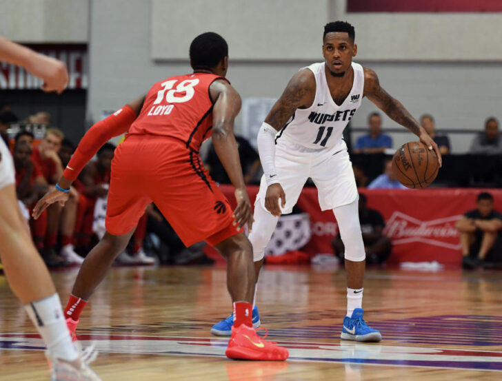 Denver Nuggets guard Monte Morris (11) dribbles against Toronto Raptors guard Jordan Loyd (18) during the second half at Cox Pavilion.