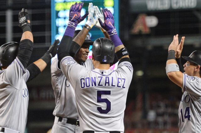 Rockies players celebrate Ramiel Tapia's grand slam Friday night. Credit: Joe Camporeale, USA TODAY Sports.