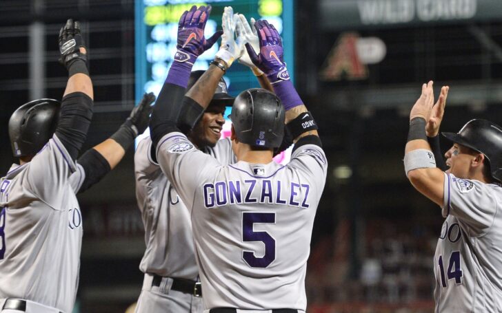 Rockies players celebrate Ramiel Tapia's grand slam Friday night. Credit: Joe Camporeale, USA TODAY Sports.