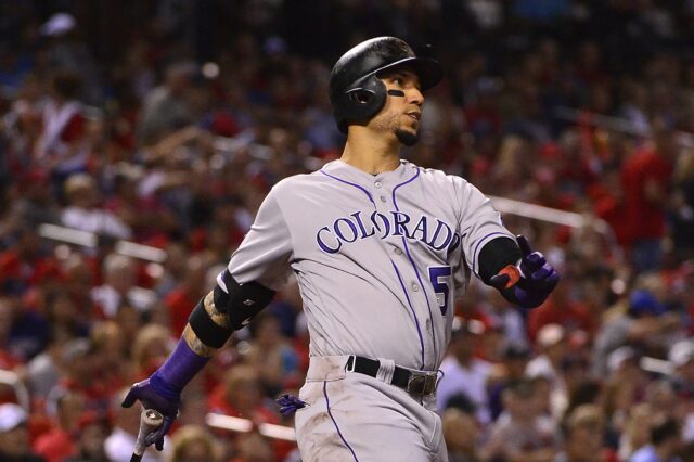 Carlos Gonzalez struts his stuff as he crushed the home run in the seventh. Credit: Jeff Curry, USA TODAY Sports.