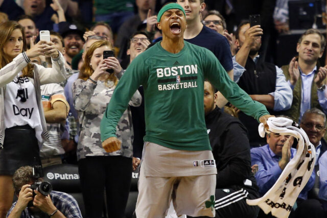 Boston Celtics guard Isaiah Thomas (4) celebrates in the final moments of the Boston Celtics 112-94 win over the Milwaukee Bucks at TD Garden.