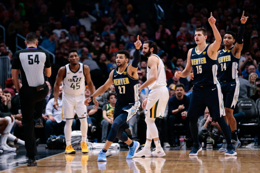 Utah Jazz guard Donovan Mitchell (45) and guard Ricky Rubio (3) look to referee Ray Acosta (54) as Denver Nuggets guard Jamal Murray (27) and center Nikola Jokic (15) and guard Gary Harris (14) motion in the third quarter at the Pepsi Center.