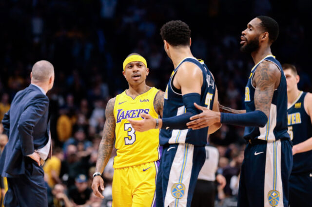 Denver Nuggets forward Will Barton (5) separates guard Jamal Murray (27) from Los Angeles Lakers guard Isaiah Thomas (3) after the game at the Pepsi Center.