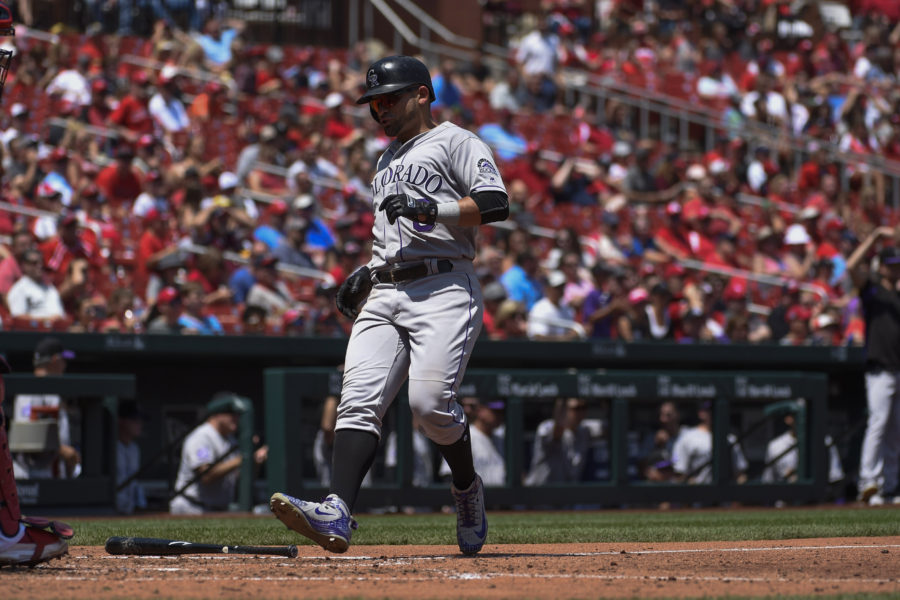 Colorado Rockies left fielder Gerardo Parra (8) scores a run against the St. Louis Cardinals during the fourth inning at Busch Stadium.