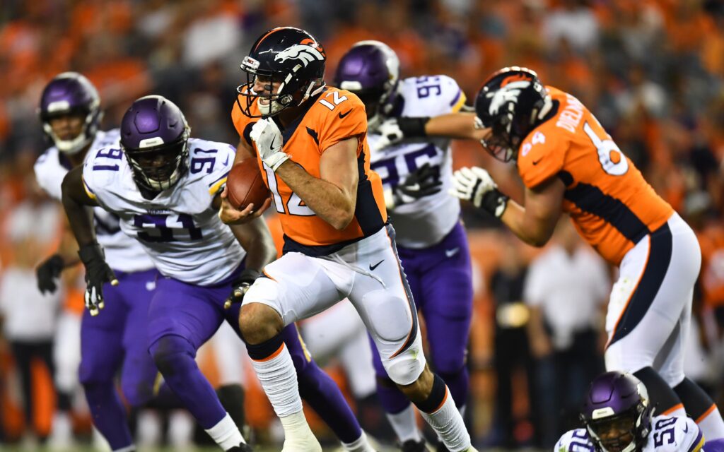 Paxton Lynch scrambles. Credit: Ron Chenoy, USA TODAY Sports.