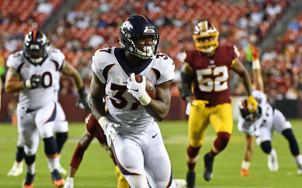 Royce Freeman runs for a touchdown against Washington. Credit: Brad Mills, USA TODAY Sports.