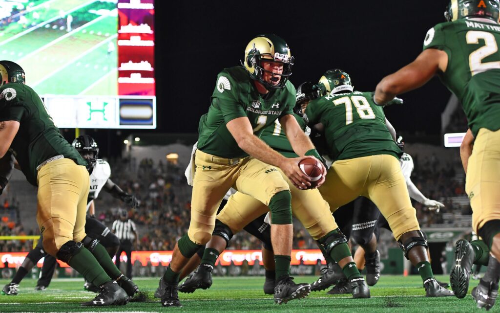 K.J. Carta-Samuels and the Rams o-line. Credit: Ron Chenoy, USA TODAY Sports.