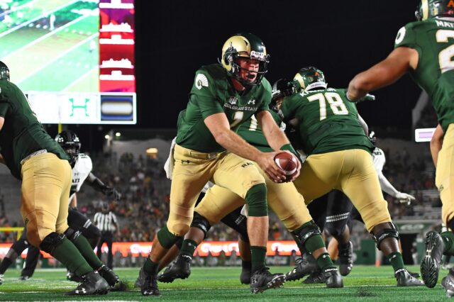 K.J. Carta-Samuels and the Rams o-line. Credit: Ron Chenoy, USA TODAY Sports.