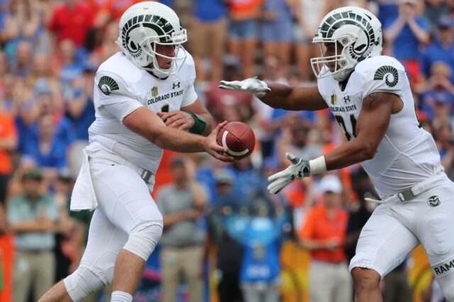 K.J. Carta-Samuels hands off to Izzy Matthews. Credit: Kim Klement, USA TODAY Sports.