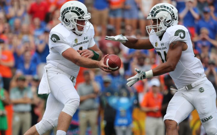 K.J. Carta-Samuels hands off to Izzy Matthews. Credit: Kim Klement, USA TODAY Sports.