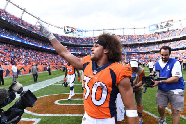 Denver Broncos running back Phillip Lindsay (30) celebrates the win over the Oakland Raiders at Broncos Stadium at Mile High.