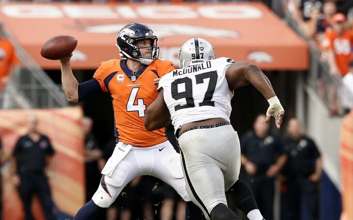 Case Keenum and former Broncos player Clinton McDonald. Credit: Isaiah J. Downing, USA TODAY Sports.