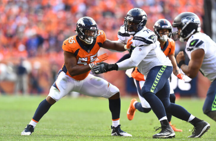 Denver Broncos outside linebacker Bradley Chubb (55) pass rushes on Seattle Seahawks center Ethan Pocic (77) in the fourth quarter at Broncos Stadium at Mile High.