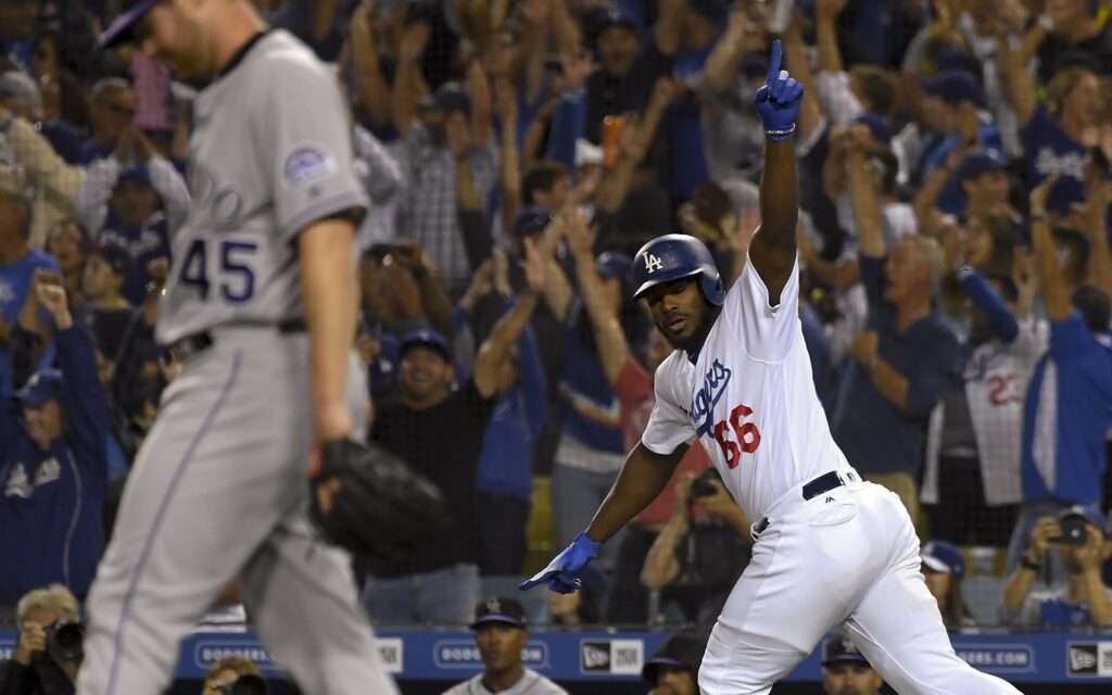 Yasiel Puig celebrates his home run while Scott Oberg walks away in sadness. Credit: Jayne Kamin-Oncea, USA TODAY Sports.