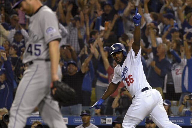 Yasiel Puig celebrates his home run while Scott Oberg walks away in sadness. Credit: Jayne Kamin-Oncea, USA TODAY Sports.