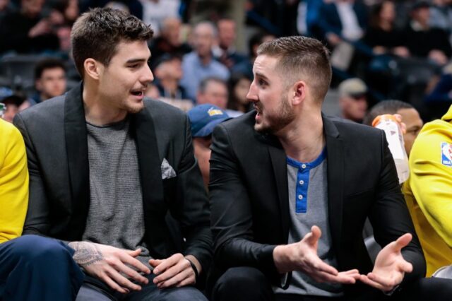 Denver Nuggets forward Juancho Hernangomez (L) talks with forward Tyler Lydon (R) in the second quarter against the Dallas Mavericks at the Pepsi Center.