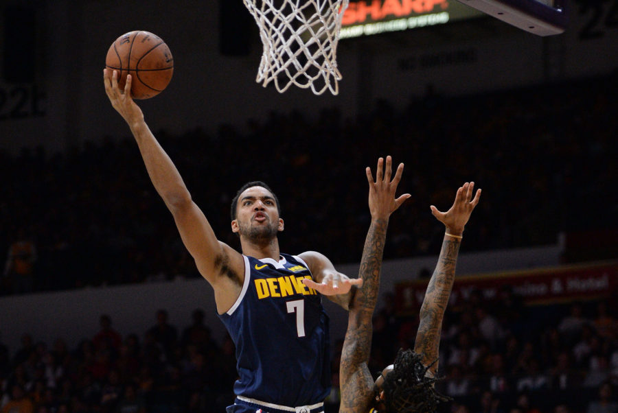 Los Angeles Lakers forward Brandon Ingram (14) draws a foul as Denver Nuggets forward Trey Lyles (7) goes to the basket during the second half at Valley View Casino Center.