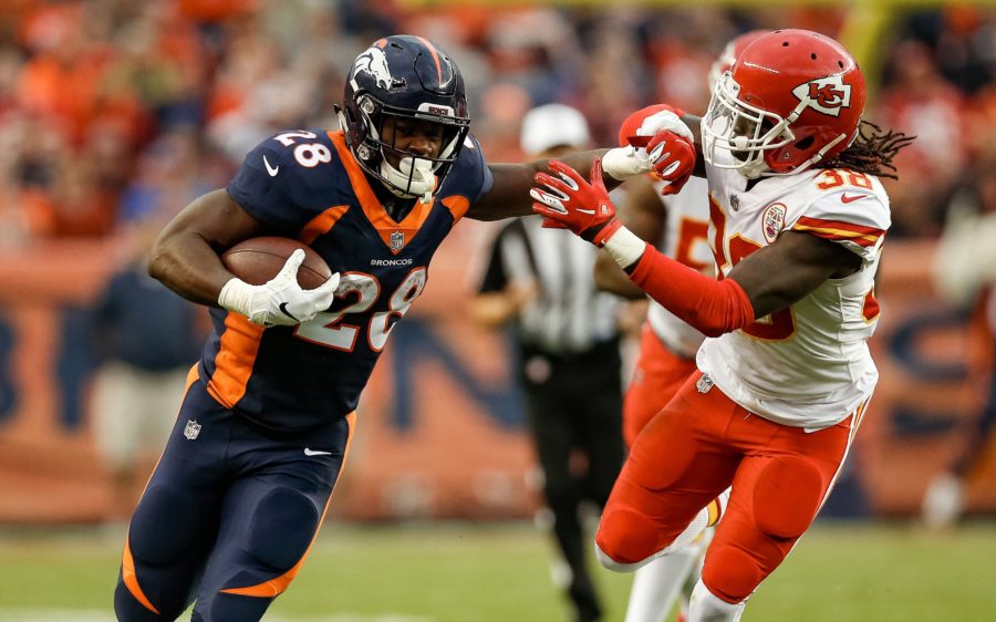 Royce Freeman stiff-arms a defender. Credit: Isaiah J. Downing, USA TODAY Sports.