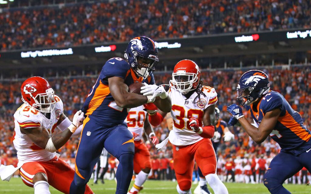 Royce Freeman drags a defender into the end zone. Credit: Mark J. Rebilas, USA TODAY Sports.