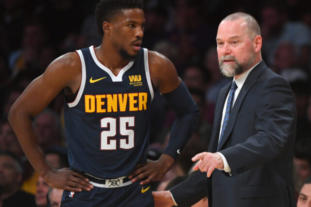 Denver Nuggets guard Malik Beasley (25) talks with head coach Michael Malone (right) in the first half of the game against the Los Angeles Lakers at Staples Center.