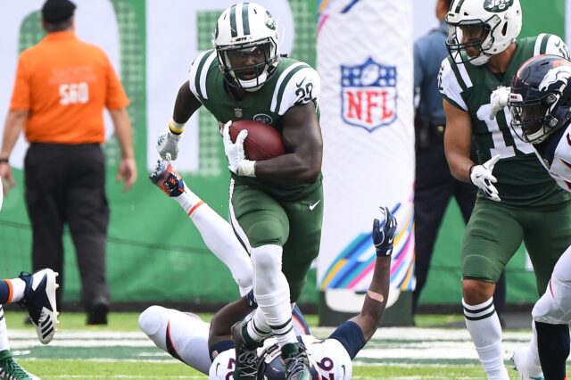 Isaiah Crowell runs over a Broncos defender. Credit: Robert Deutsch, USA TODAY Sports.