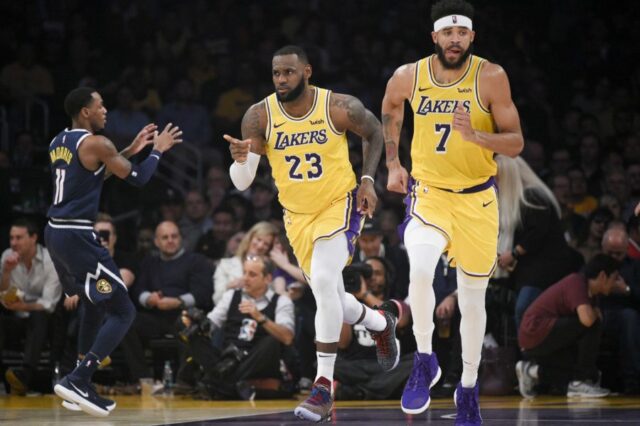 Los Angeles Lakers forward LeBron James (23) reacts after a shot during the first half against the Denver Nuggets at Staples Center.