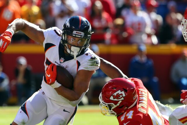 Phillip Lindsay runs out of a tackle. Credit: Jay Biggerstaff, USA TODAY Sports.