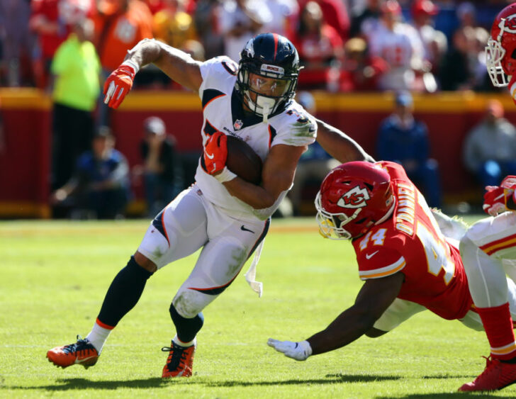 Denver Broncos running back Phillip Lindsay (30) is tackled by Kansas City Chiefs linebacker Dorian O'Daniel (44) in the first half at Arrowhead Stadium