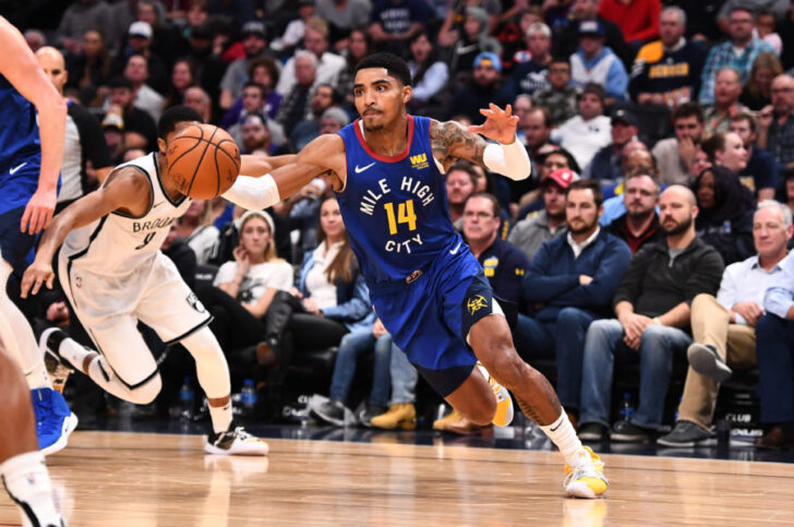 Denver Nuggets guard Gary Harris (14) drives to the basket in the second half against the Denver Nuggets at the Pepsi Center.