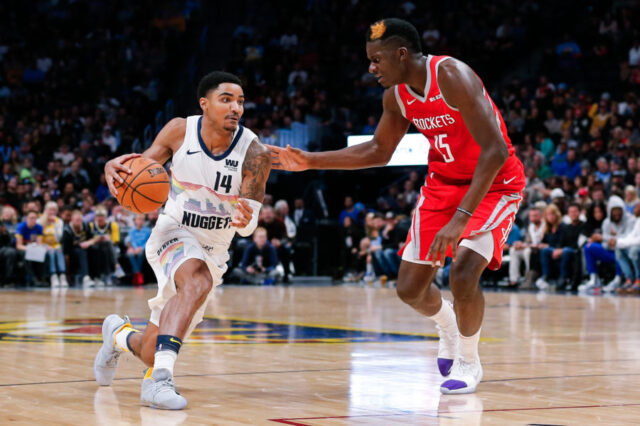 Houston Rockets center Clint Capela (15) guards Denver Nuggets guard Gary Harris (14) in the second quarter at the Pepsi Center.