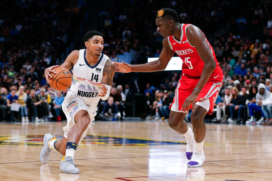 Houston Rockets center Clint Capela (15) guards Denver Nuggets guard Gary Harris (14) in the second quarter at the Pepsi Center.