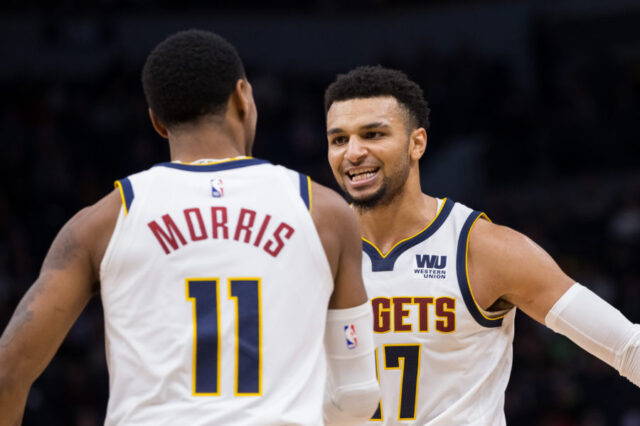 Denver Nuggets guard Jamal Murray (27) celebrates with guard Monte Morris (11) in the third quarter against Minnesota Timberwolves at Target Center.