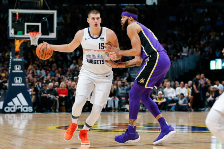 Los Angeles Lakers center JaVale McGee (7) guards Denver Nuggets center Nikola Jokic (15) in the first quarter at the Pepsi Center.