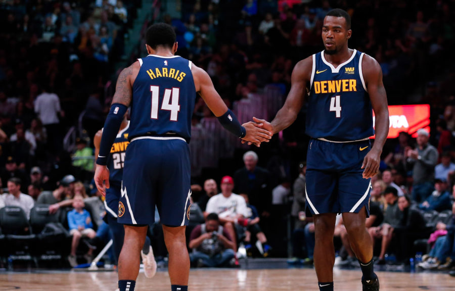 Denver Nuggets guard Gary Harris (14) reacts with forward Paul Millsap (4) after a play in the third quarter against the New Orleans Pelicans at the Pepsi Center.