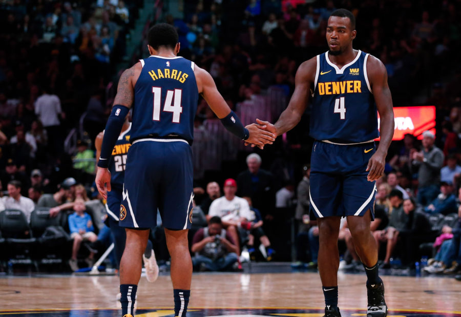 Denver Nuggets guard Gary Harris (14) reacts with forward Paul Millsap (4) after a play in the third quarter against the New Orleans Pelicans at the Pepsi Center.